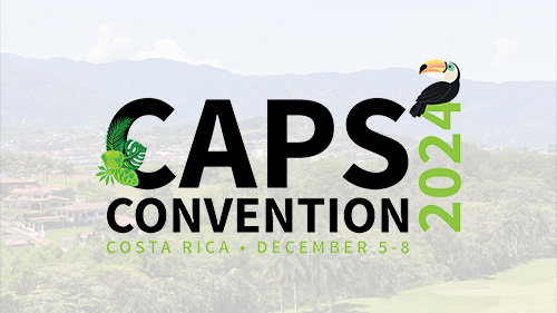 CAPS Convention banner, logo with lightly shaded photo of Costa Rica